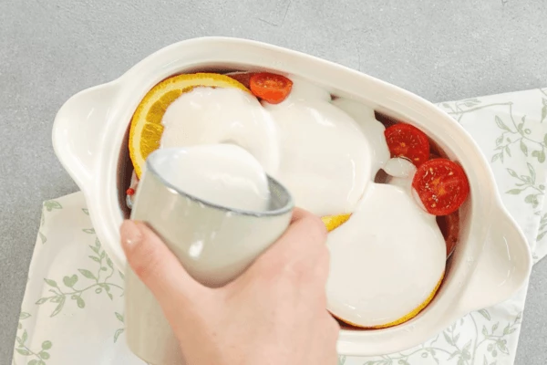  Залить кефиром, посолить, положить веточку орегано. 